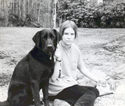 Barbara as a girl with her black Lab
